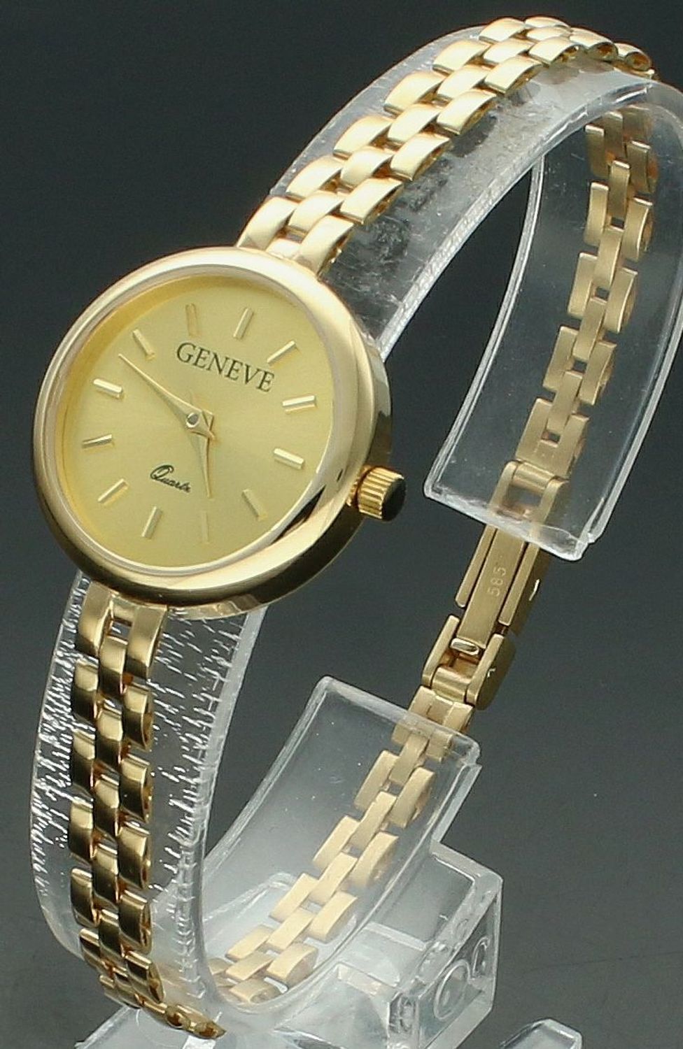 Zegarek złoty GENEVE ZG 200 585 Złoty zegarek Geneve damski wysokiej próby 585 o łącznej masie 19,60 gram złota ZG 200 585. Czasomierz posiada tarczę w nieskazitelnym złotym kolorze emanującą subtelnością.1.jpg